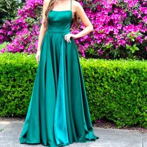 Long emerald green formal gown with lace up back